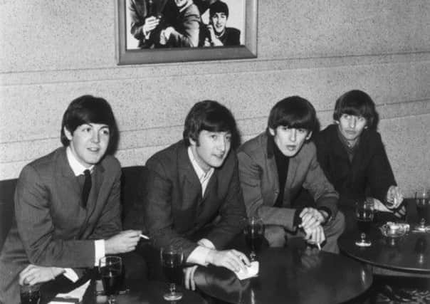 The Beatles sit down and relax with drinks in Edinburgh. Picture: TSPL