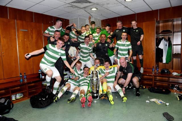 A jubilant Celtic Under-17 side celebrate with the City of Glasgow Cup after Aidan Nesbitts goal secured a 1-0 win at Parkhead. Picture: SNS