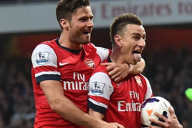 Arsenals Laurent Koscielny, right, celebrates his opening goal with Olivier Giroud. Picture: Getty