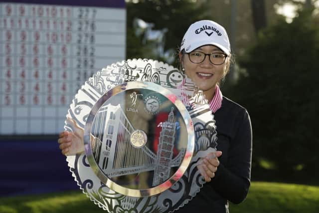 Lydia Ko of New Zealand poses with her trophy. Picture: AP