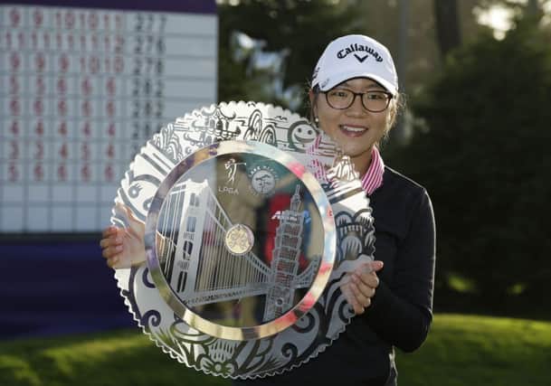 Lydia Ko of New Zealand poses with her trophy. Picture: AP