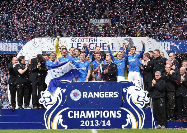 Rangers celebrate lifting the League One trophy. Picture: SNS