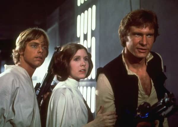 Mark Hamill, Carrie Fisher, and Harrison Ford will return in the next installment. Picture: AP