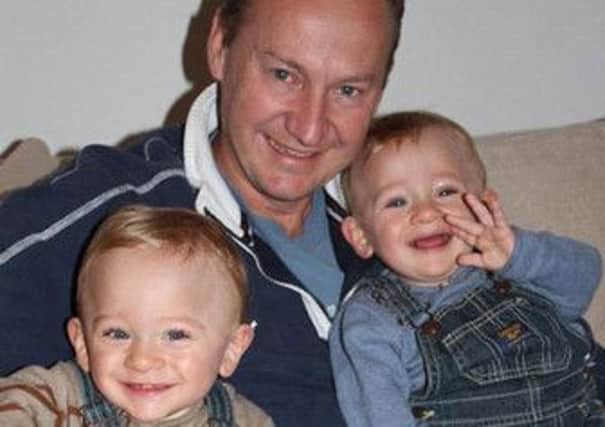 Gary Clarence with his three-year-old twin sons Ben and Max