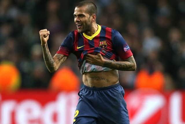 Barcelona's Dani Alves ate a banana thrown at him from the stands. Picture: PA