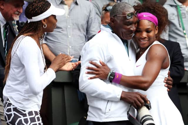 Richard Williams, with Venus Williams looking on, congratulates daughter Serena after she won Wimbledon in 2007. Picture: Getty