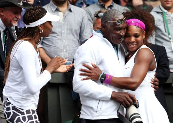 Richard Williams, with Venus Williams looking on, congratulates daughter Serena after she won Wimbledon in 2007. Picture: Getty
