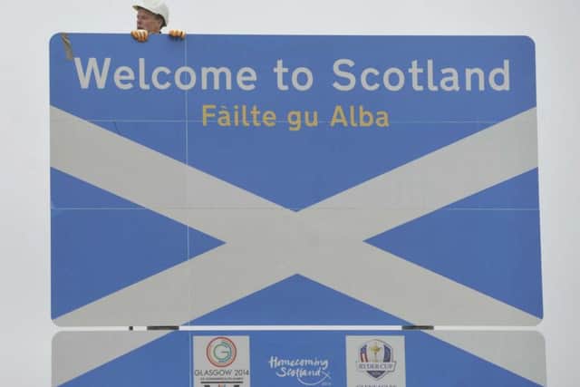 The new Border sign, complete with Commonwealth Games. Homecoming Scotland and Ryder Cup logos. Picture: Phil Wilkinson