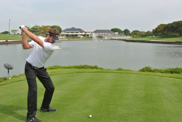 The consistently improving Scott Jamieson hits his teeshot at Laguna National in Singapore. Picture: Getty