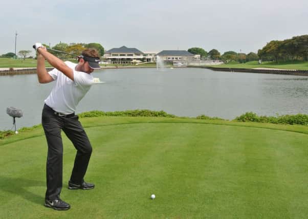 The consistently improving Scott Jamieson hits his teeshot at Laguna National in Singapore. Picture: Getty