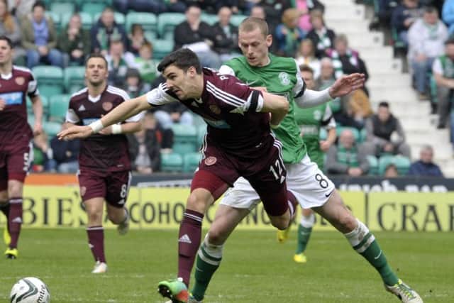 Hibs' Scott Robertson tackles Callum Paterson