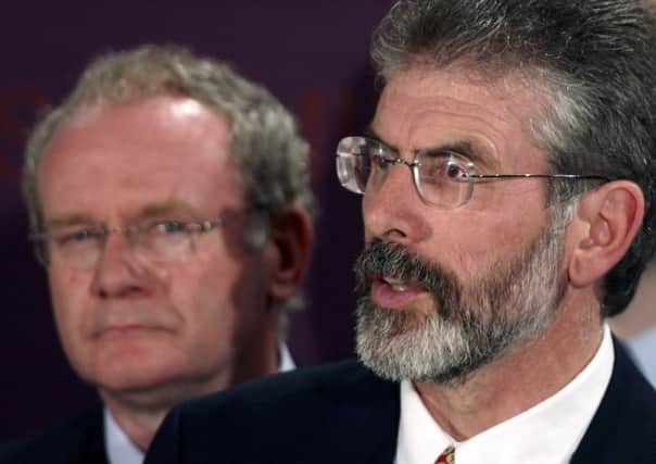 Martin McGuinness, left, with Gerry Adams in 2006. Picture: Getty