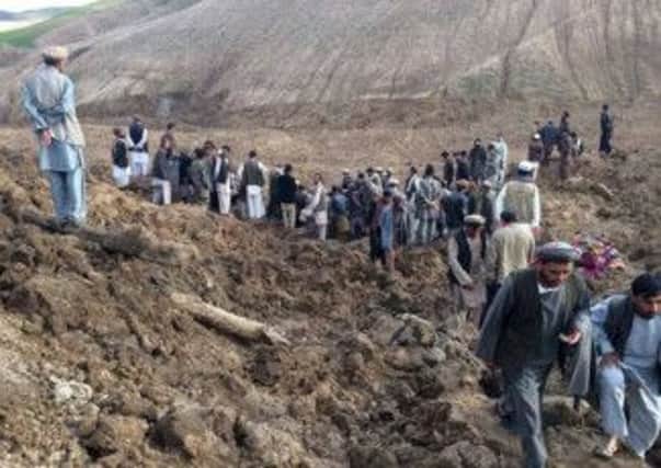 Afghans search for survivors after a massive landslide landslide buried a village in Badakhshan province, northeastern Afghanistan. Picture: AP