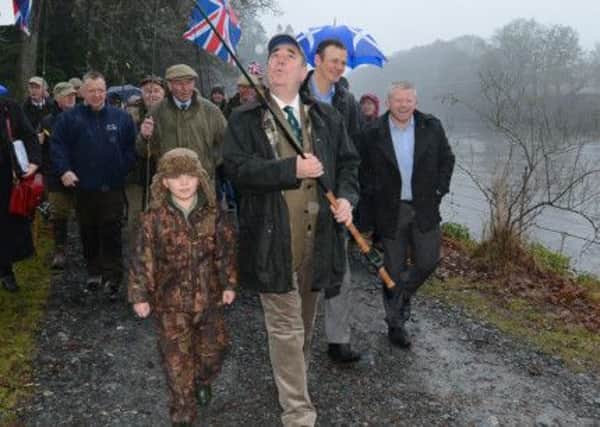 First Minister Alex Salmond started the salmon fishing season on the River Tay in January, but will he now close it on 12 fishing fleets in Scottish waters. Picture:TSPL