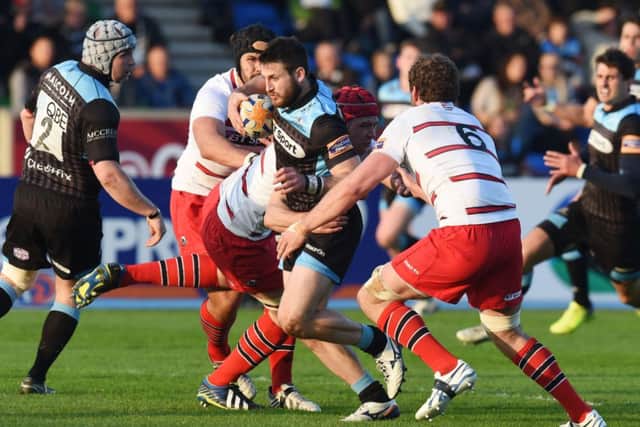 Tommy Seymour, pictured here breaking through against Edinburgh last week, scored a hat-trick against Treviso to put his side level on points with Leinster. Picture: SNS