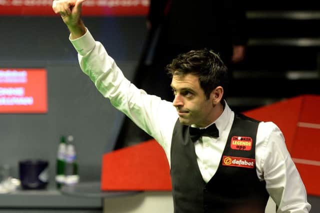 Ronnie O'Sullivan celebrates after winning his semi final of The Dafabet World Snooker Championships against Barry Hawkins at The Crucible. Picture: PA