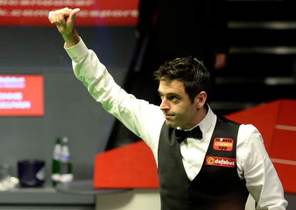 Ronnie O'Sullivan celebrates after winning his semi final of The Dafabet World Snooker Championships against Barry Hawkins at The Crucible. Picture: PA