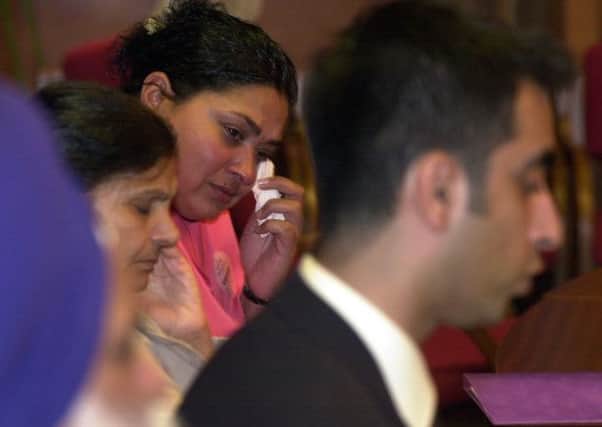 Manjit Chhokar listens to  Aamer Anwar during  the family press conference. It was the first public statement,on her sons death that Mrs Chhokar had made for three years Picture: TSPL