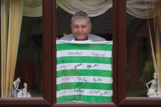 Former Celtic player John 'Yogi' Hughes at home in Glasgow .  With a jersey signed by some of his illustrious Celtic teammates from the 1960's.  Picture: Robert Perry