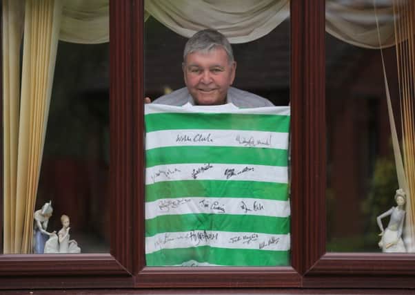 Former Celtic player John 'Yogi' Hughes at home in Glasgow .  With a jersey signed by some of his illustrious Celtic teammates from the 1960's.  Picture: Robert Perry