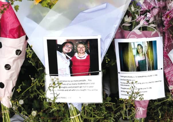 Tributes for Ann Maguire outside Corpus Christi School in Leeds. Photograph: Lynne Cameron/PA