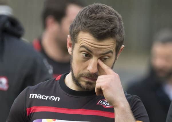 End of an era: Greig Laidlaw leaves the field after playing his last home match. Picture: SNS