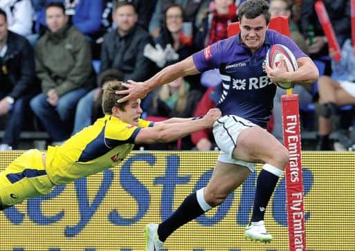 Lee Jones breaks Tom Lucass tackle to score the clinching try against Australia. Picture: Ian Rutherford