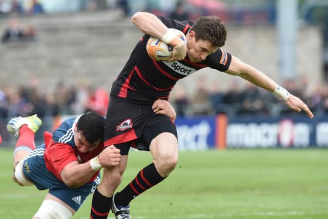 Munsters Paddy Butler gets to grips with Carl Bezuidenhout during Edinburghs home defeat. Picture: SNS