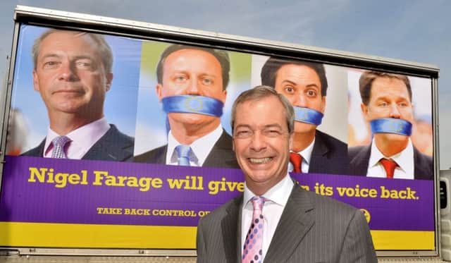 Nigel Farage unveils a new billboard in Lambeth, south London yesterday. Picture: PA
