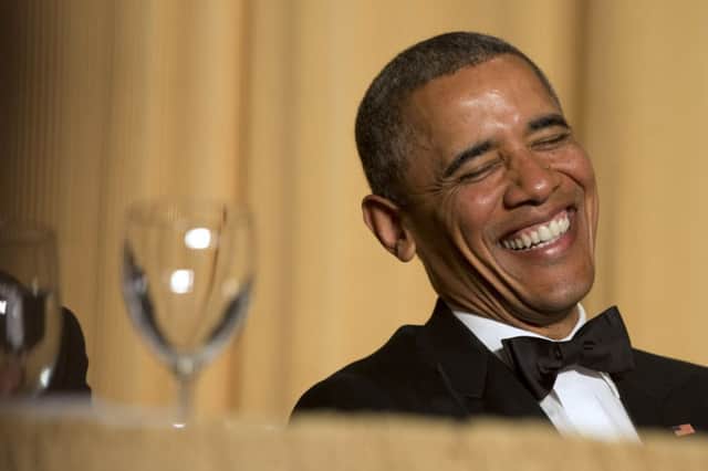 President Obama laughs as actor and comedian Joel McHale makes his speech during the White House Correspondents Dinner. Picture: AP
