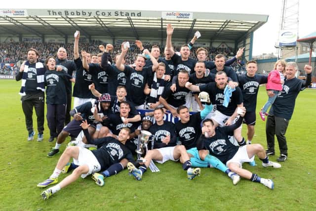 Dundee celebrate clinching the SPFL Championship title and promotion to the Premiership. Picture: SNS