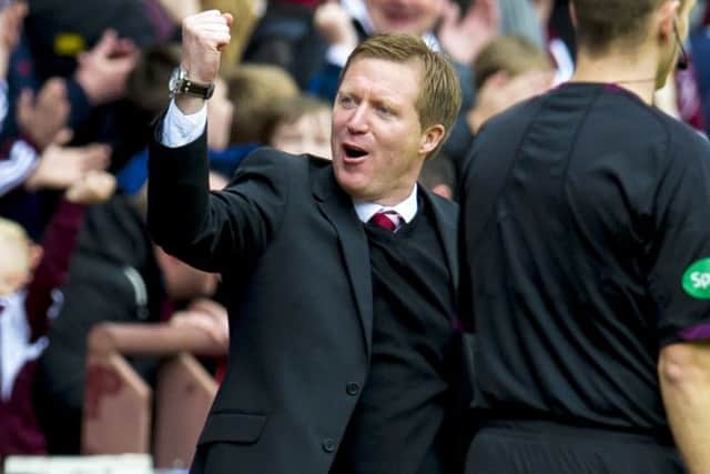Hearts manager Gary Locke punches the air with delight at full-time. Picture: SNS