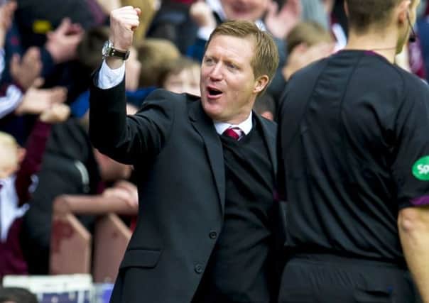 Hearts manager Gary Locke punches the air with delight at full-time. Picture: SNS