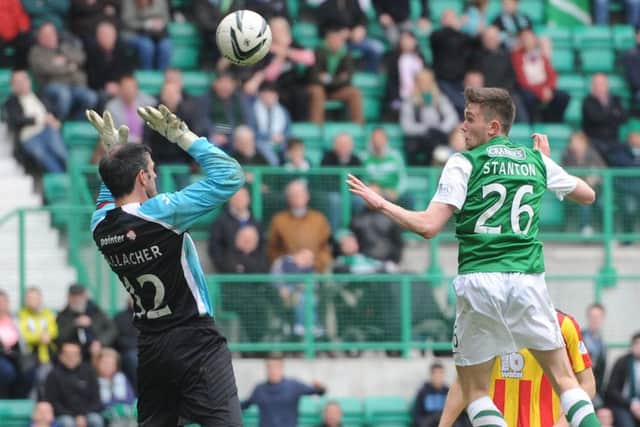Sam Stanton rises to loop the ball over Partick goalkeeper Paul Gallacher for a late equaliser. Picture: Neil Hanna