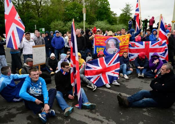 Protestors gathered outside Antrim PSNI Station as Adams was set to be released. Picture: Getty
