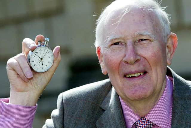 Sir Roger Bannister holds the stopwatch that recorded his sub-four-minute mile 60 years ago. Picture: PA