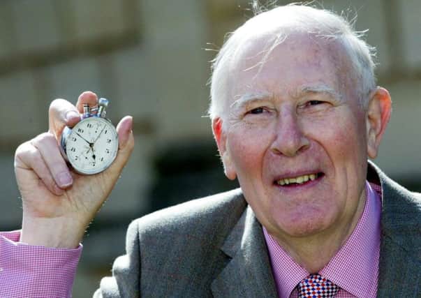 Sir Roger Bannister holds the stopwatch that recorded his sub-four-minute mile 60 years ago. Picture: PA