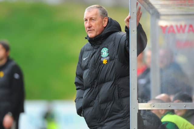 Hibs boss Terry Butcher is urging his players to win against Ross County and secure their safety. Picture: TSPL