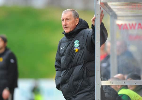 Hibs boss Terry Butcher is urging his players to win against Ross County and secure their safety. Picture: TSPL