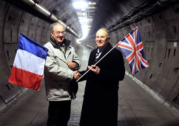 Former construction workers Philippe Cozette and Graham Fagg meet again in the tunnel after nearly 25 years. Picture: Getty