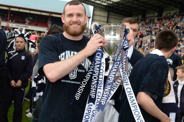 Craig Beattie of Dundee celebrates winning the title. Picture: SNS