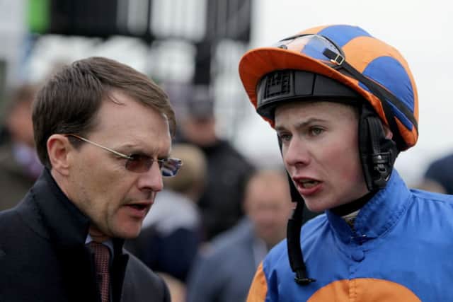 Aidan OBrien with his son Joseph, right, after Magicians victory. Picture: PA