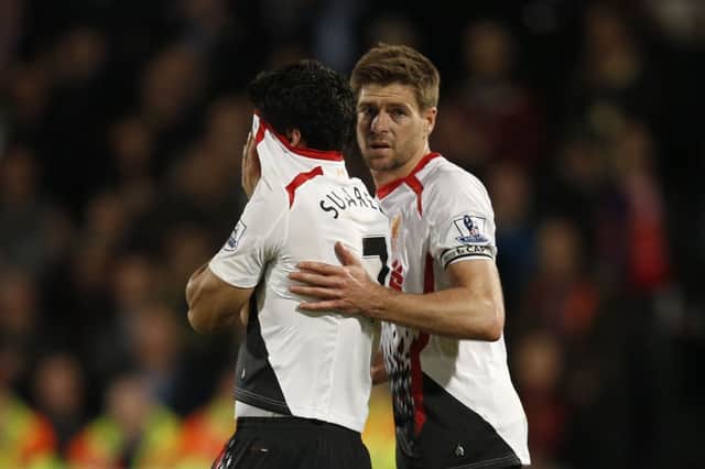 Liverpool captain  Steven Gerrard, right, consoles Luis Suarez after the 33 draw at Crystal Palace. Picture: AFP/Getty