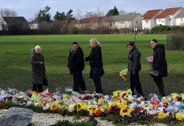 Floral tributes to Mikaeel Kular in a park near his home in Ferry Gait. Picture: Ian Rutherford