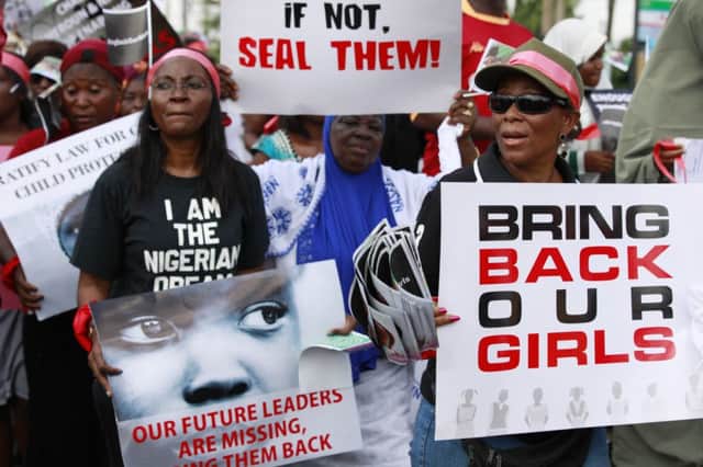 A demonstration in Nigeria calling on government to rescue the kidnapped school girls. Picture: AP