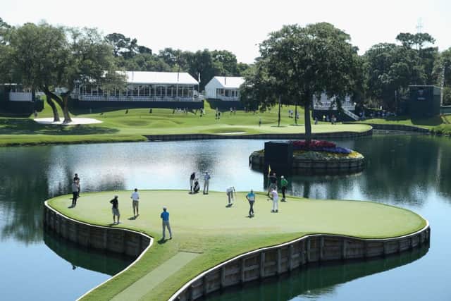 Players putt on the island green at the 17th hole at TPC Sawgrass. Picture: Getty
