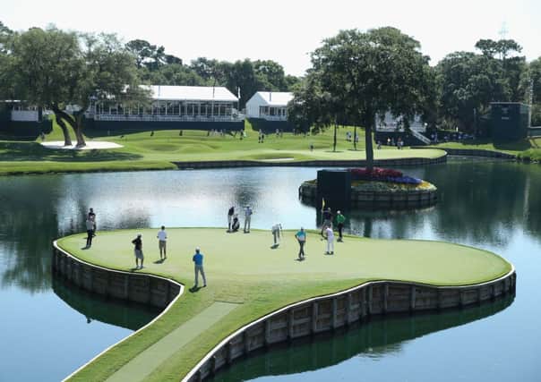 Players putt on the island green at the 17th hole at TPC Sawgrass. Picture: Getty