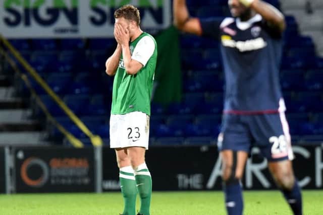 Hibs Jordon Forster holds his head. Picture: SNS Group
