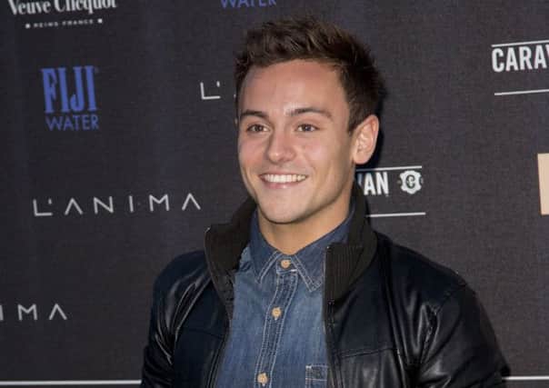 Diver Tom Daley said it was 'very exciting' to be involved as the baton begins its tour of the home nations. Picture: Getty