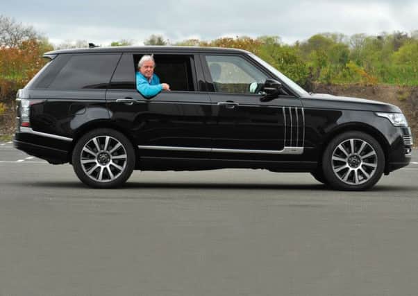 Our Alan revels in the extra legroom offered by the 17-foot long Range Rover LWB